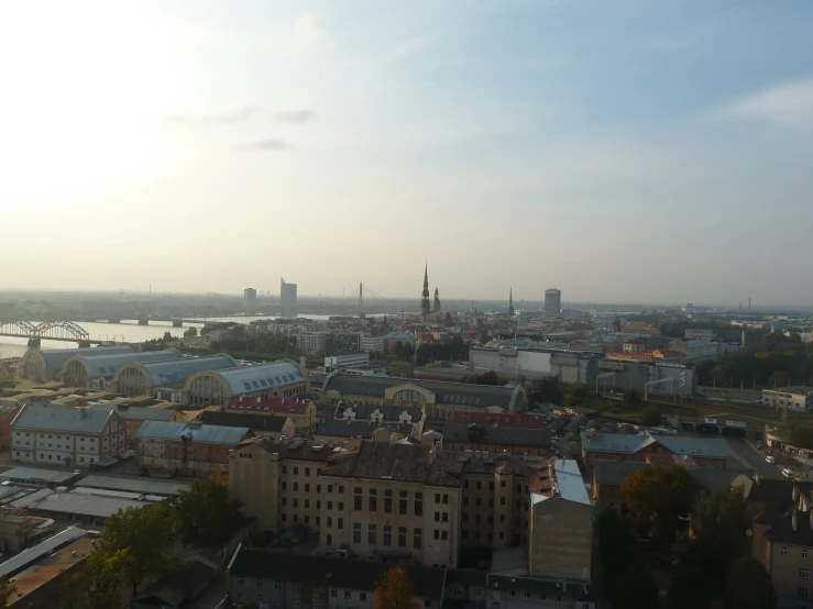 an aerial view of the city skyline with a body of water in the background