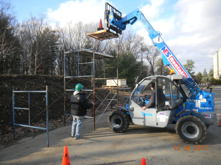 a couple of men work together on soing