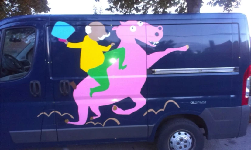 a van with a colorful painting painted on the side of it