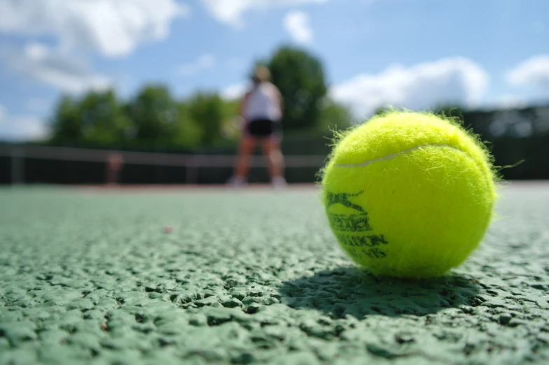 a tennis ball is laying on the ground