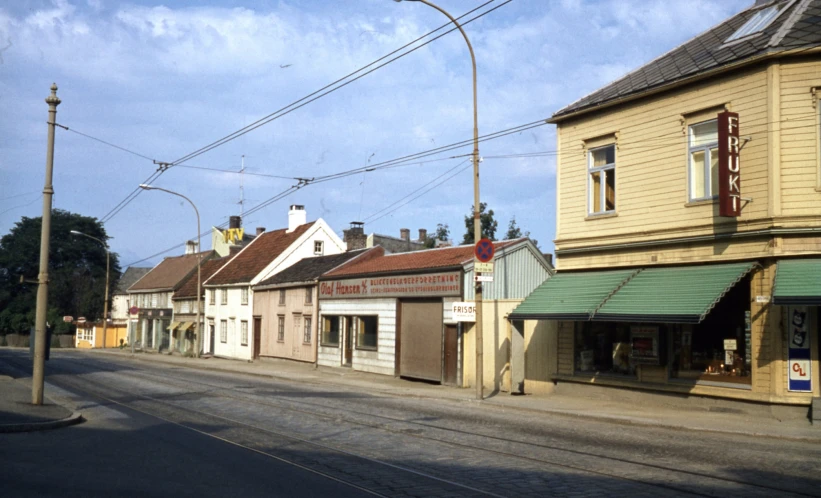 a row of stores sitting on the side of a street