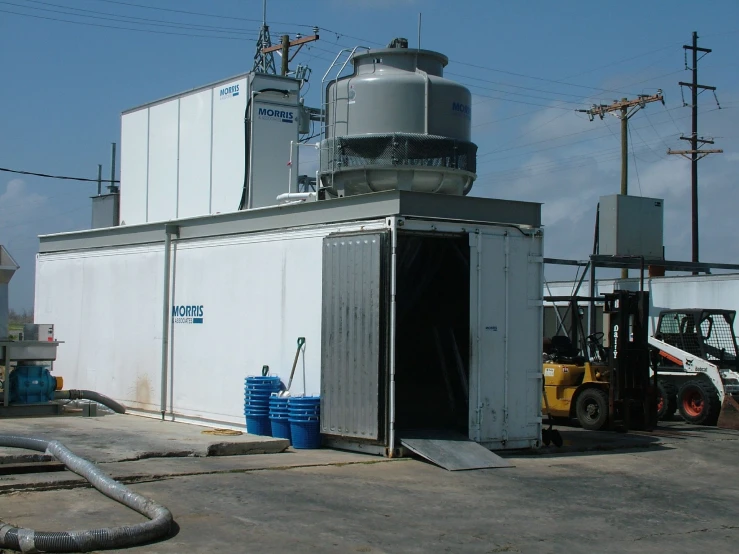 industrial storage structure with large metal tanks in the foreground