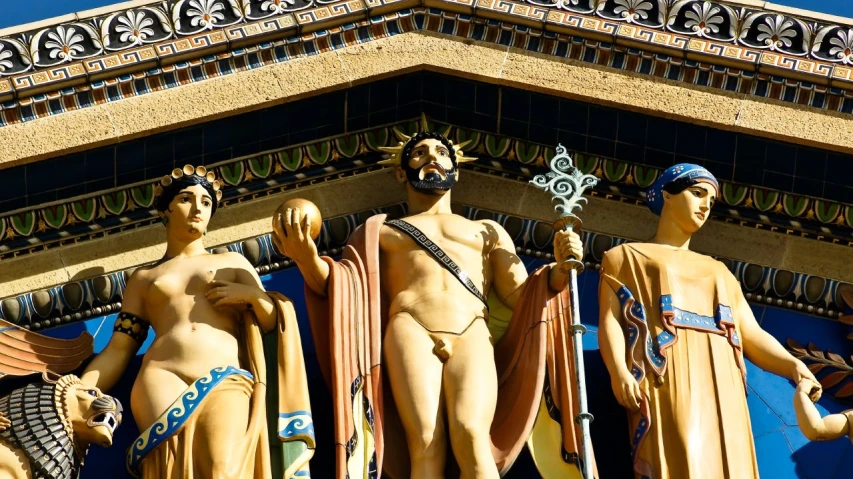 statue of roman emperors and the four goddesss on top of a building