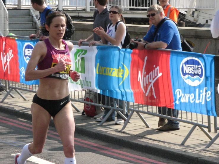 a woman with  running down the street