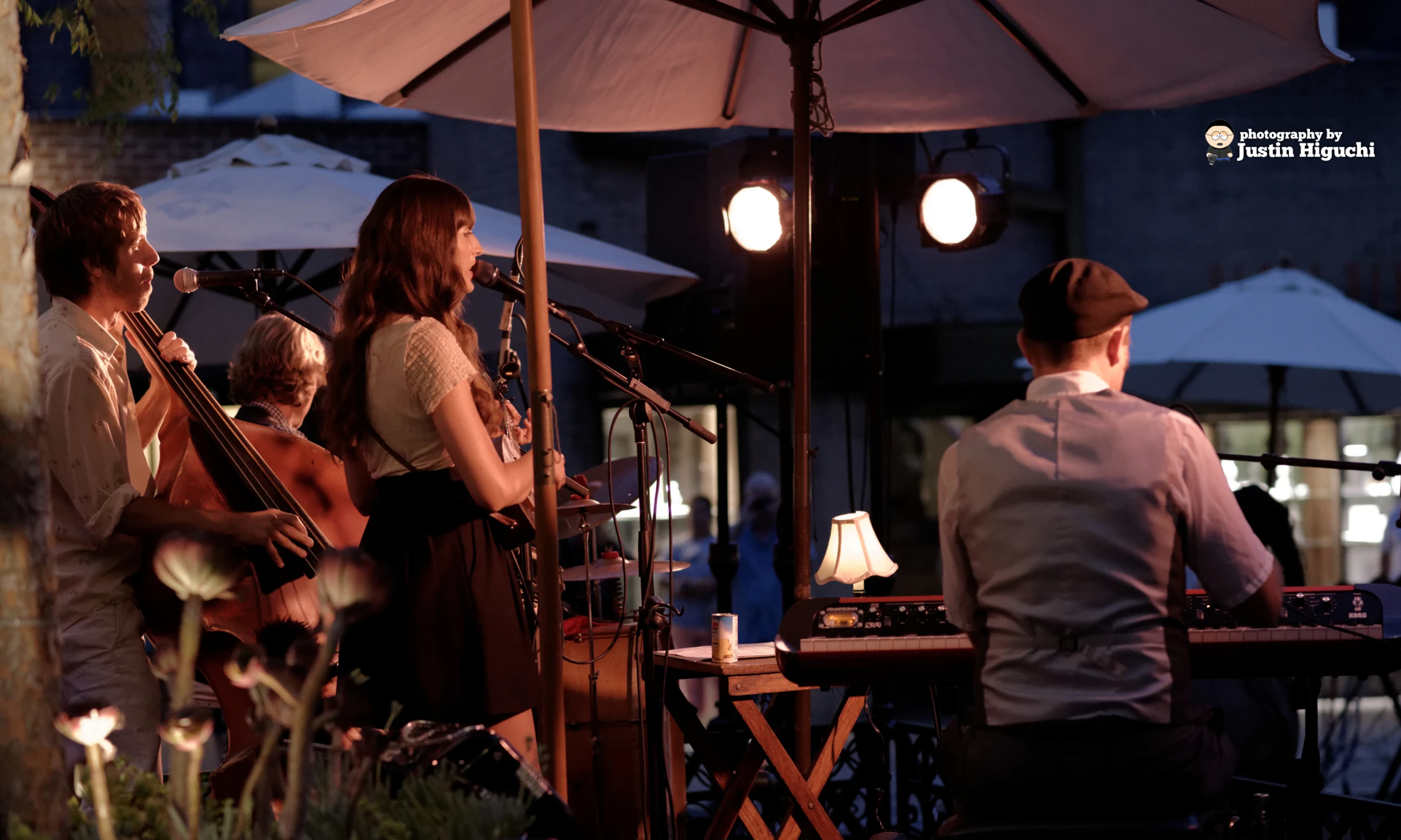 a couple of people that are sitting down with instruments