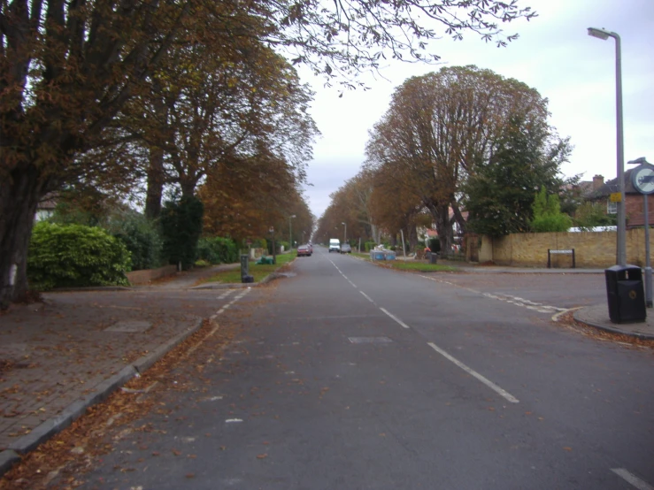 the city street is empty during the autumn