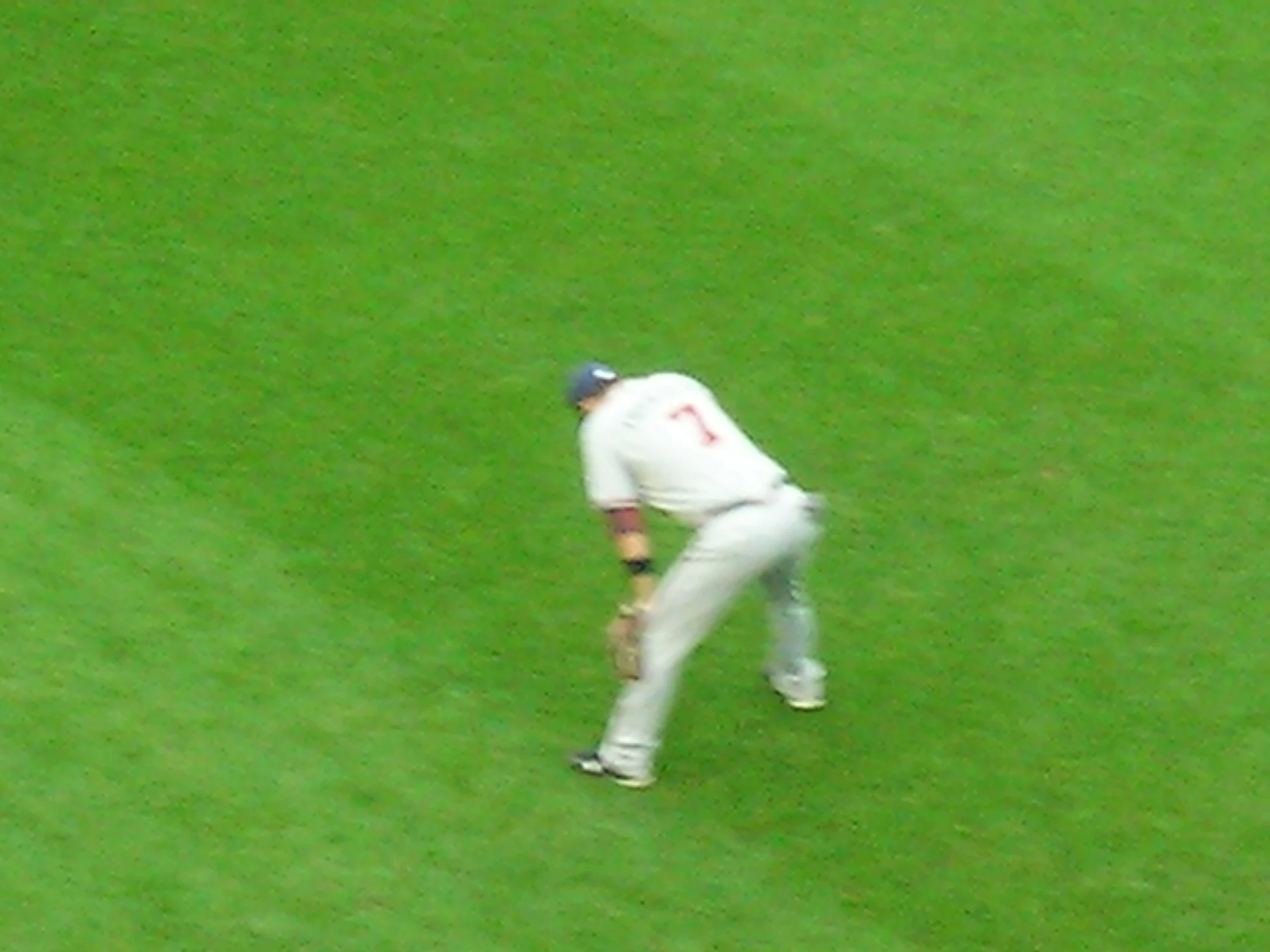 a baseball player walking onto the field