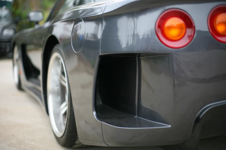 a close up view of a grey sports car