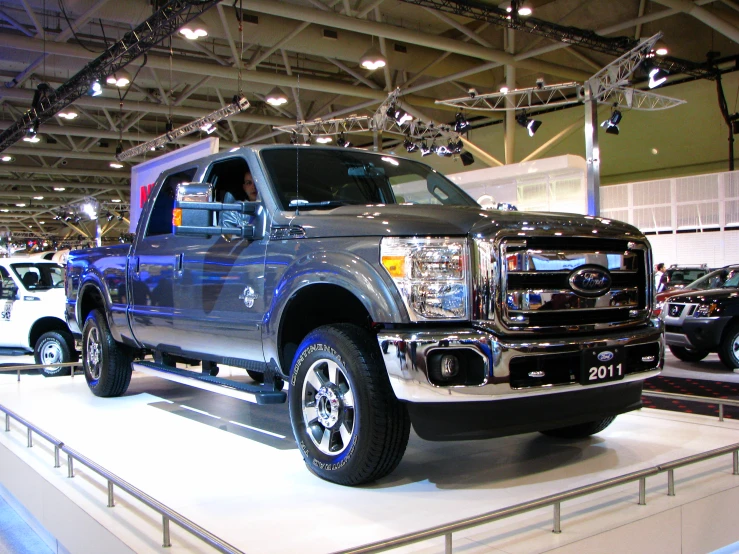 a truck is shown parked on display in a show room