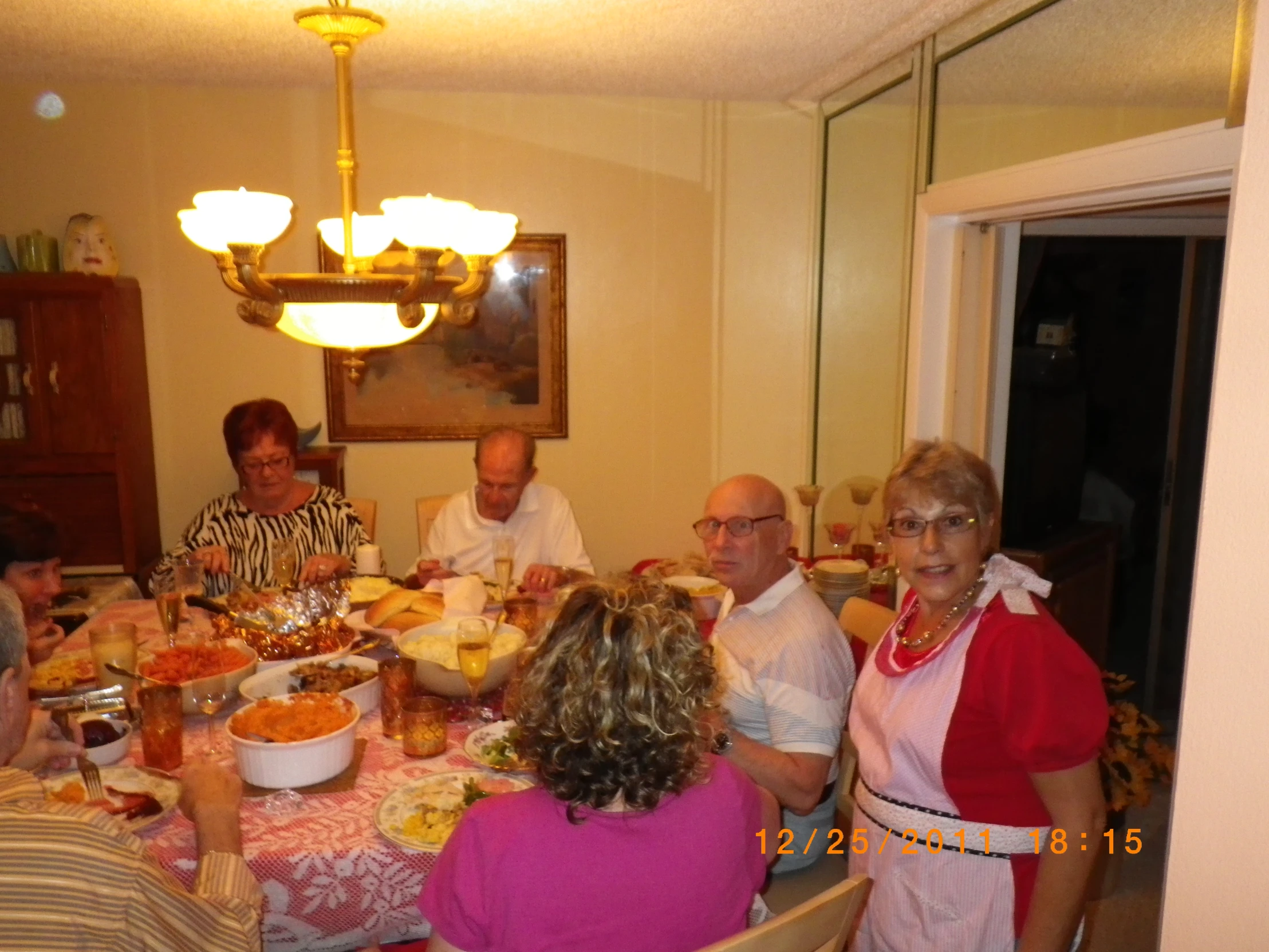 a group of people sitting at a table having a meal