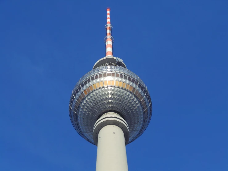 the top of a tower against a blue sky