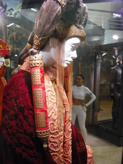 some costumes are displayed in a store case
