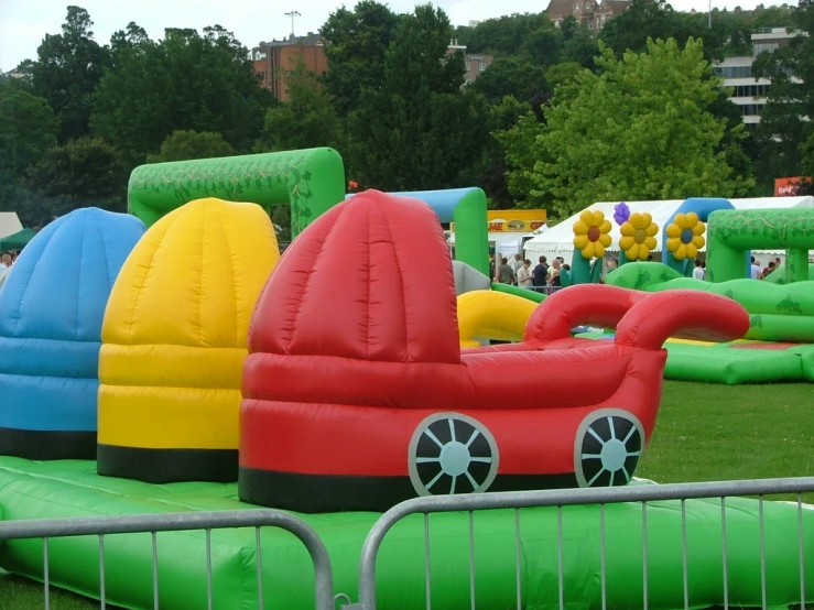 there are many inflatable toys in a field