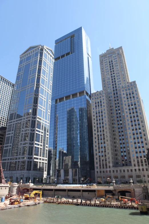 a body of water in front of tall buildings