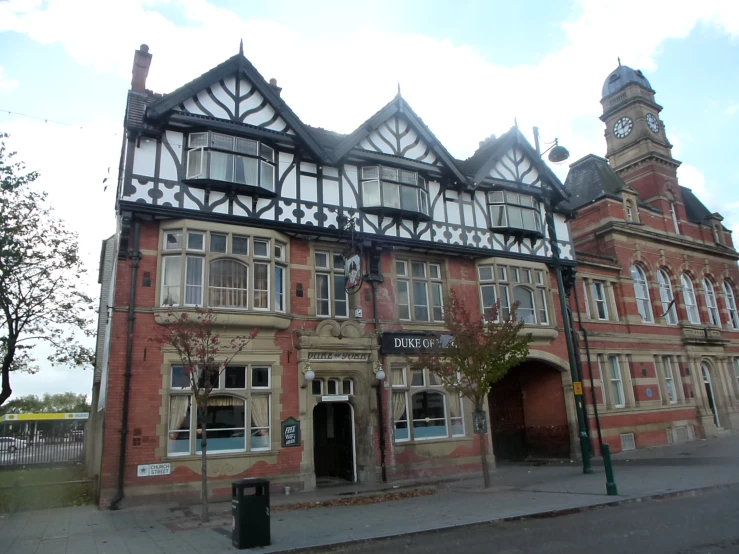 the old building has a clock tower on its corner