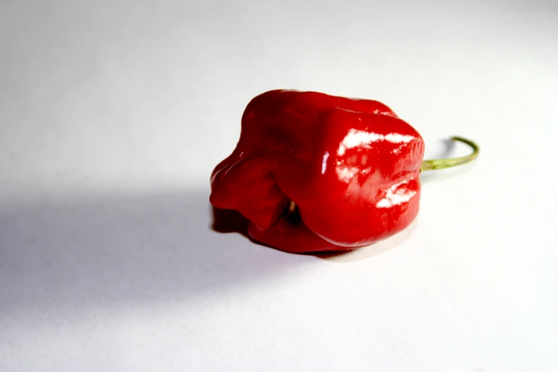 a single red pepper with an exposed center