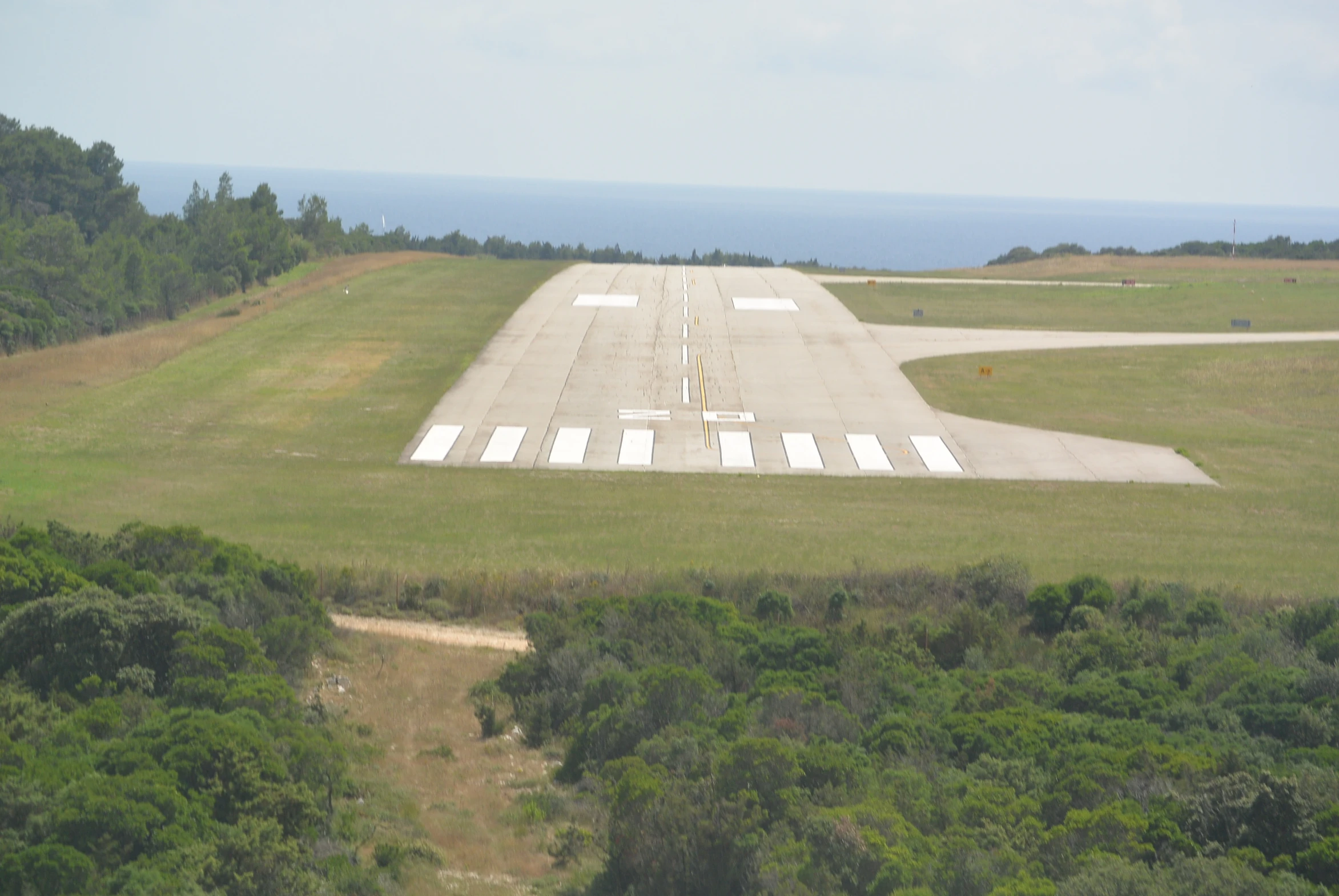 an airplane parked on an airport runway