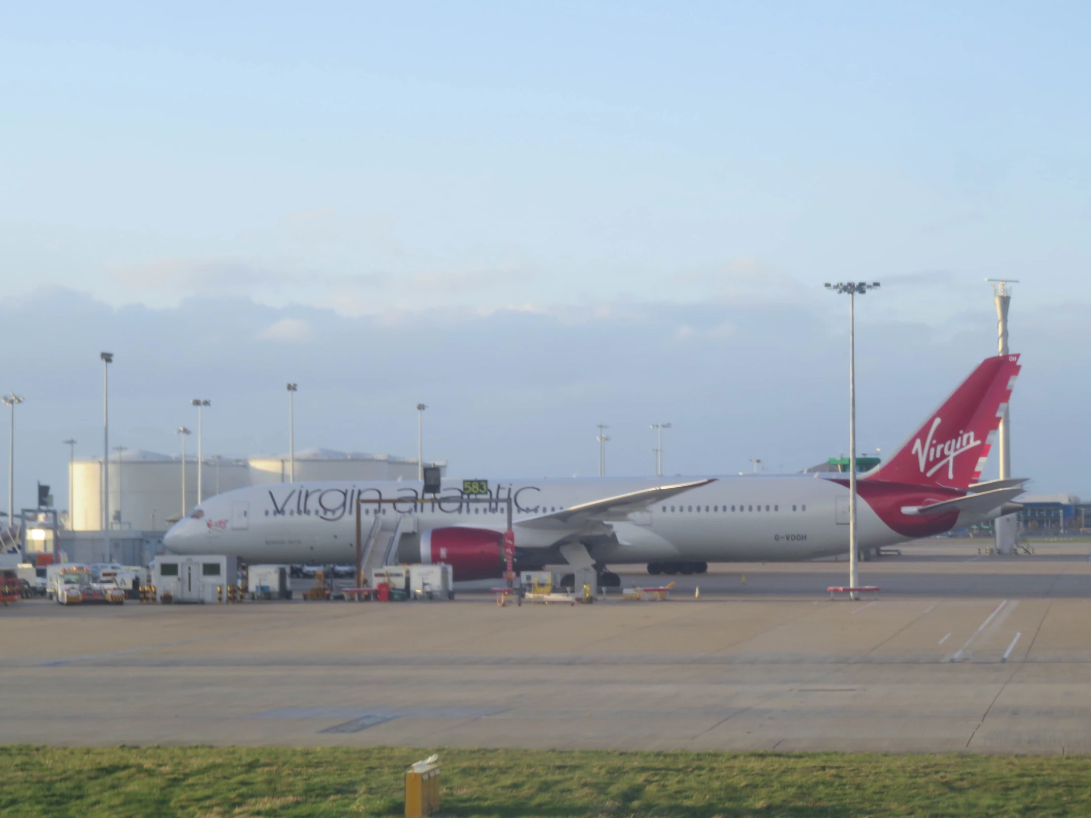 a large passenger jet sits on the runway at the airport