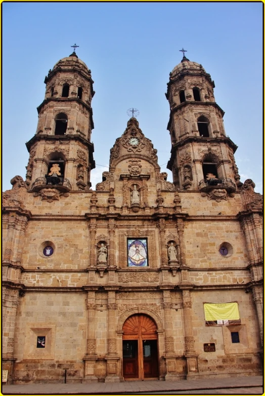 an old building with two clock towers is pictured