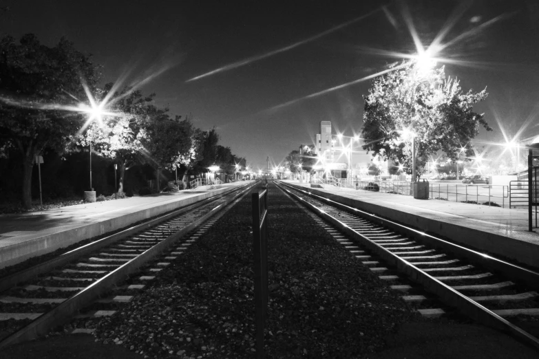 a train track going up a hill near the trees