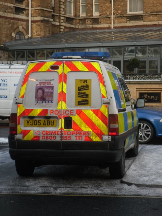 there is a police van parked in front of the police station