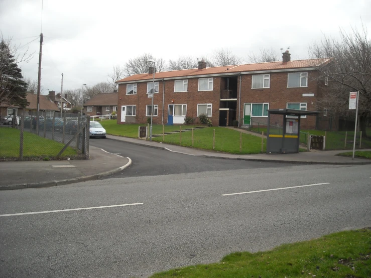 a street corner with an empty road at the end