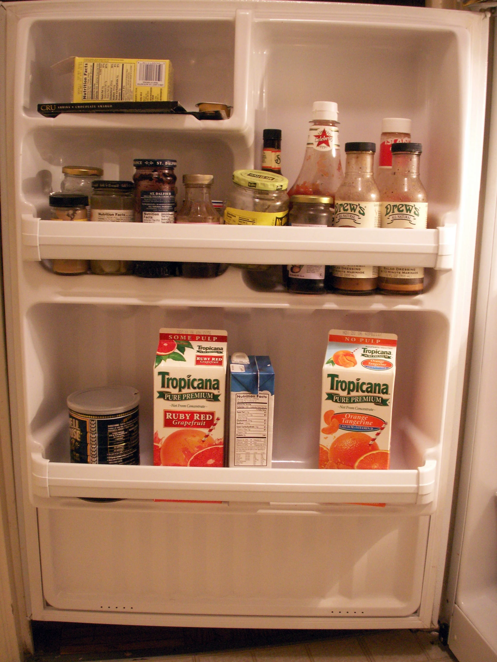an open refrigerator has many different items in it