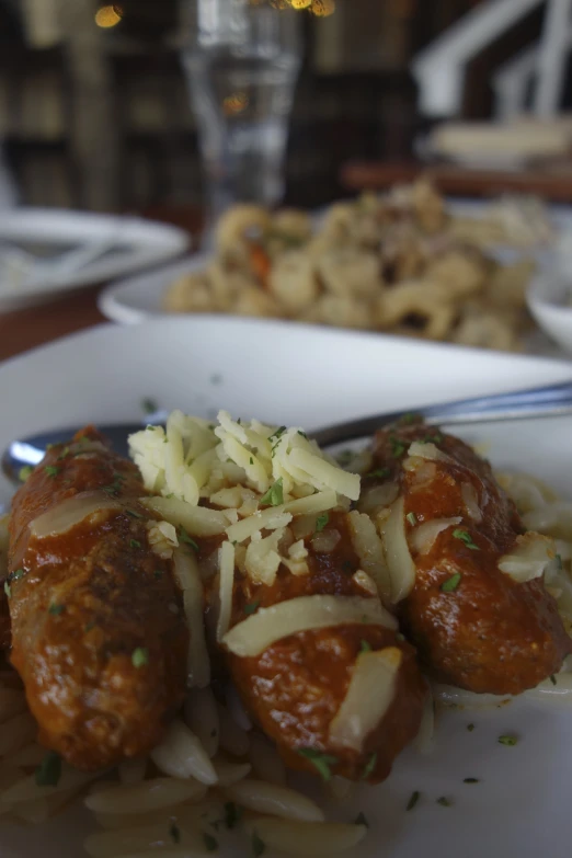 a plate with some meatball and pasta on it