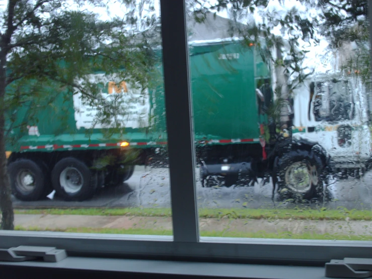 a window looking out at a large truck