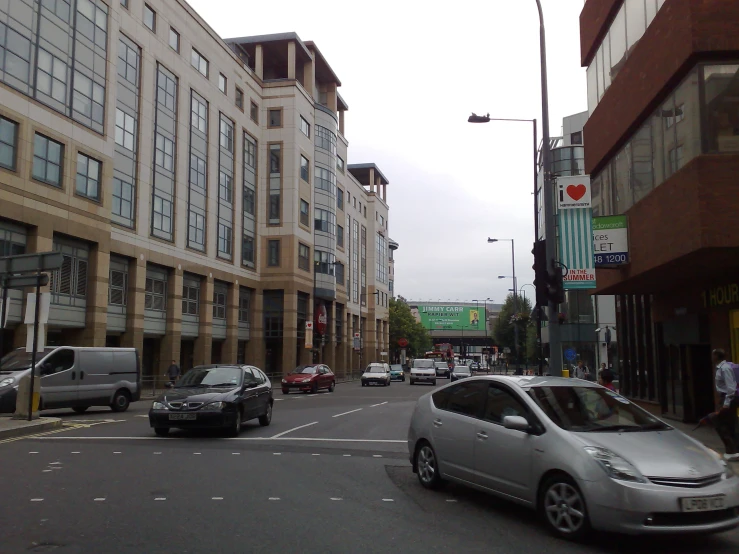 a white car is passing through a traffic light