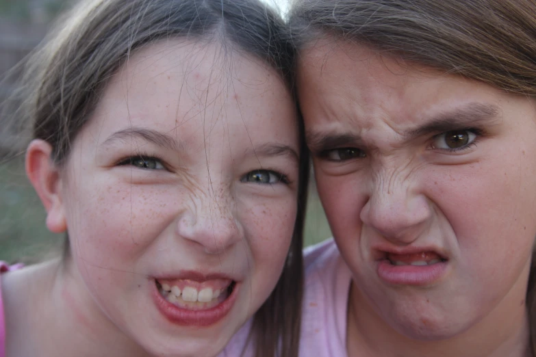 two children in the image are wearing dirty makeup