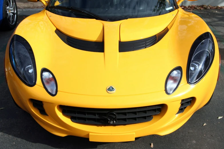 the front of a large yellow sports car