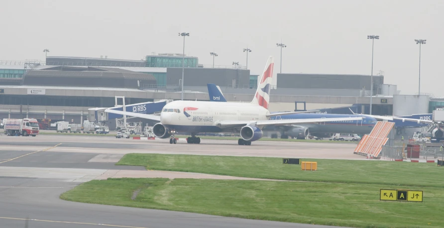 a jumbo jet airplane that is parked at the airport