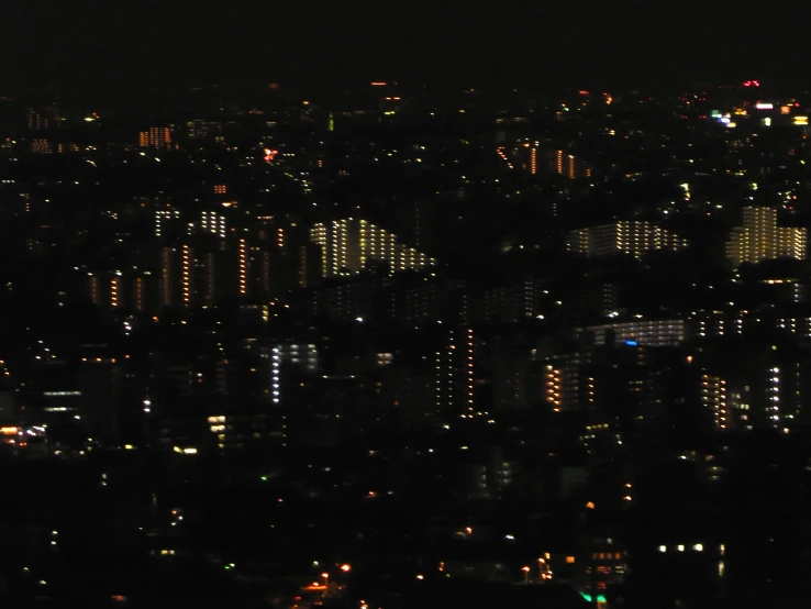 a view of the city at night from a high point