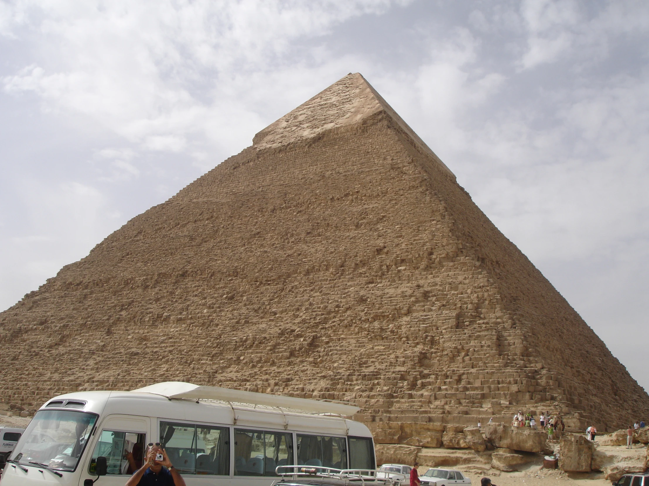 an image of people looking at a large pyramid