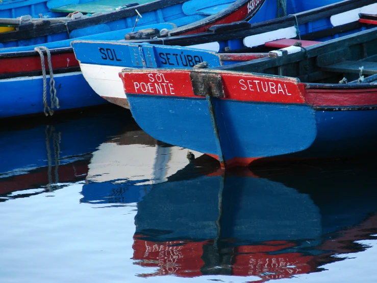 there are many boats docked at the shore