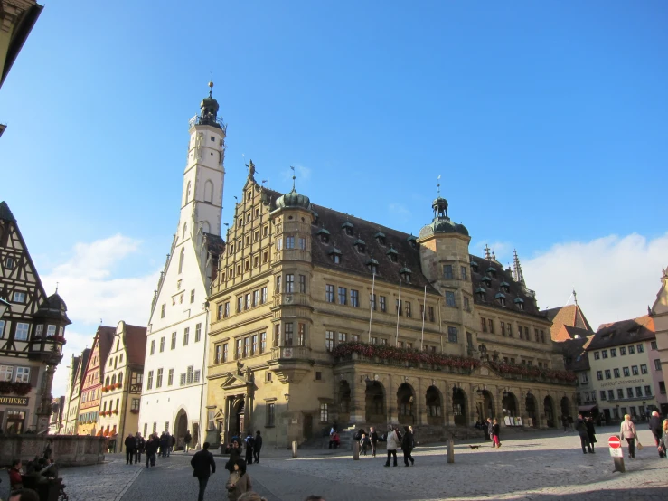 large buildings surrounding the clock tower and other ornate architecture