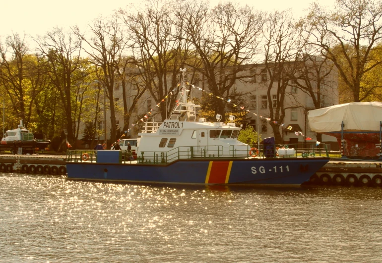 a tug boat that is pulling in to the harbor