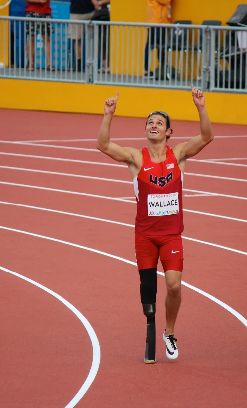 a young male running on a track