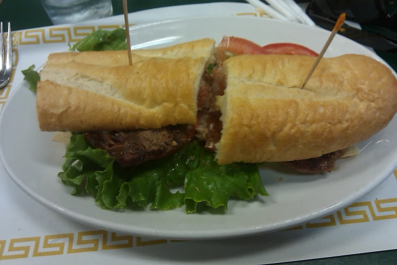 a sandwich sitting on top of a white plate