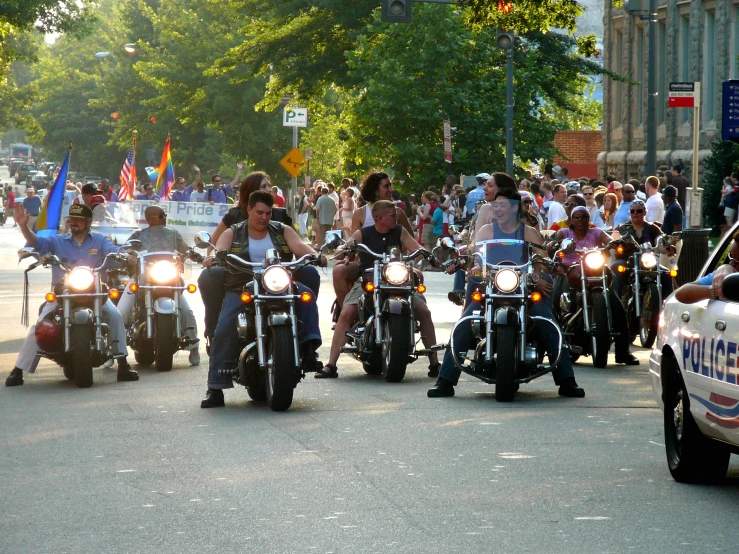 some people are riding motorcycles in formation in the street