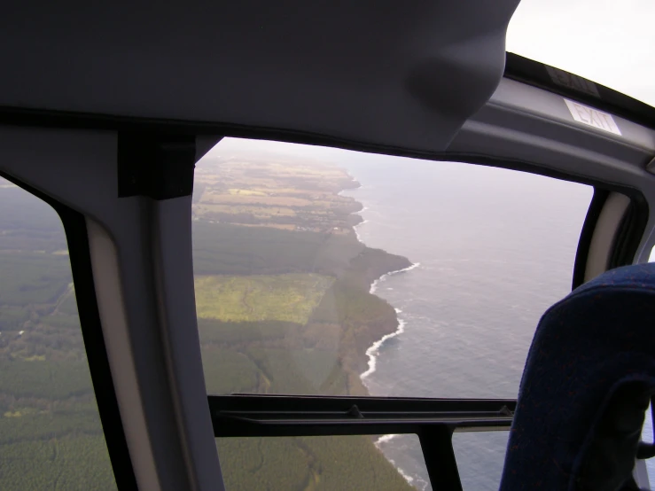 a view from an airplane as it flies over the ocean