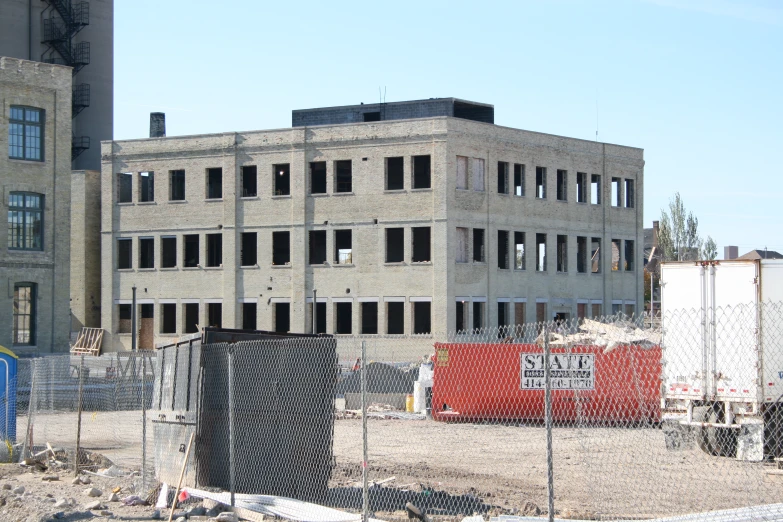 the outside of a concrete building that is under construction