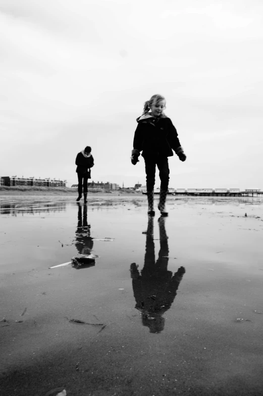 two people on the beach looking for soing to eat