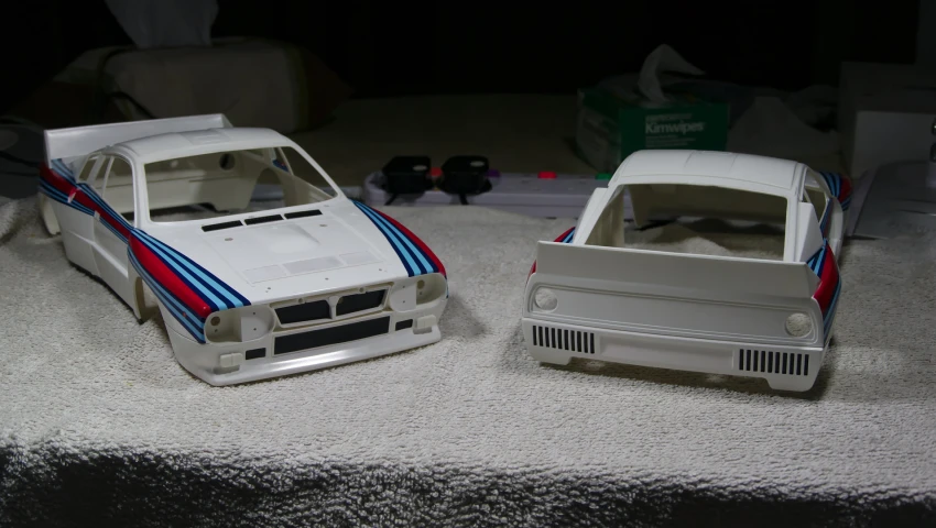 two toy cars sitting on a table