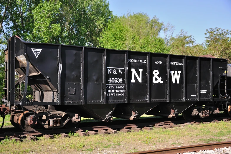 a train with black paint and graffiti on it