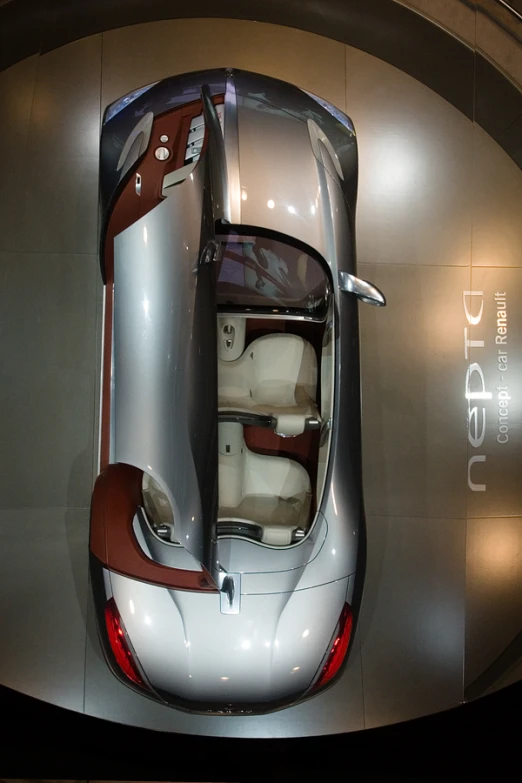 an interior view of a small vehicle displayed at an auto show