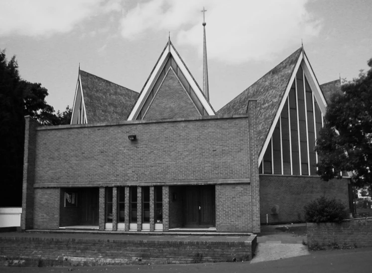 the roof and side of a building with windows