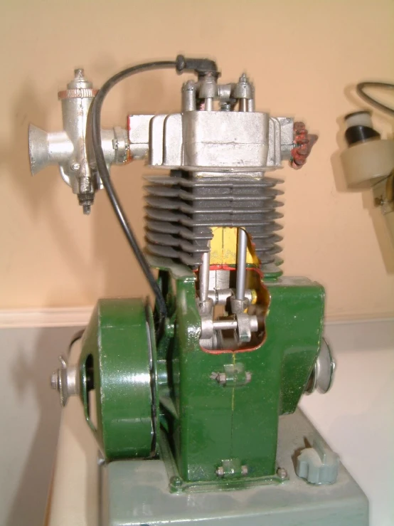 an electric engine mounted to the side of a white wall