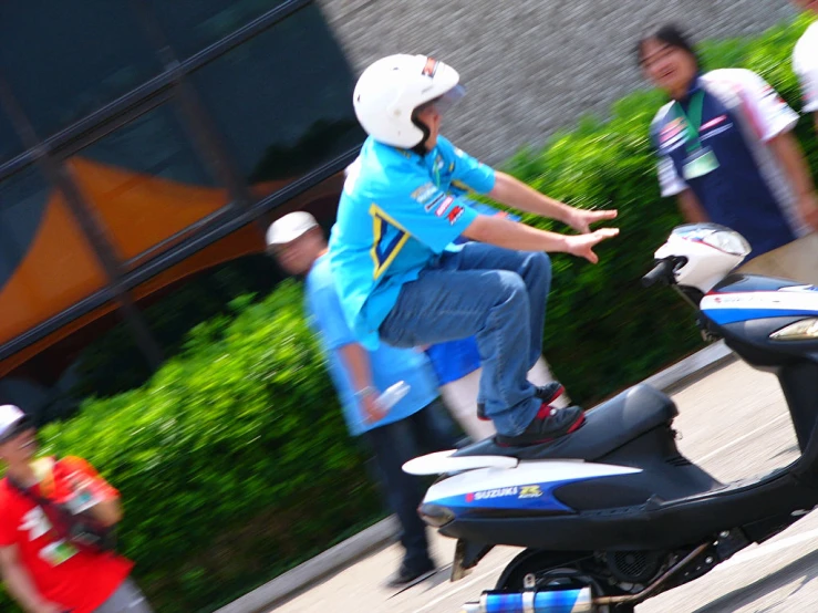 a person riding on the back of a motorcycle